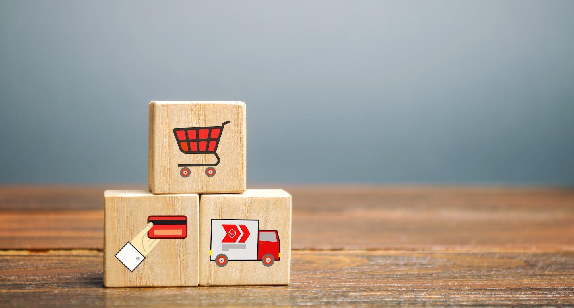 Online shopping icons for shopping cart, online payment and delivery on wooden cubes